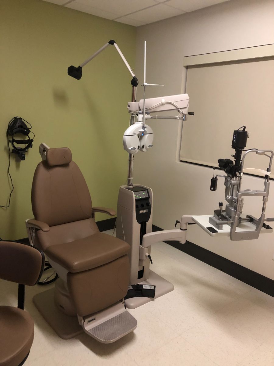 Exam chair and eye exam equipment in renovated Optometry Suite exam room at Cornerstone Family Health